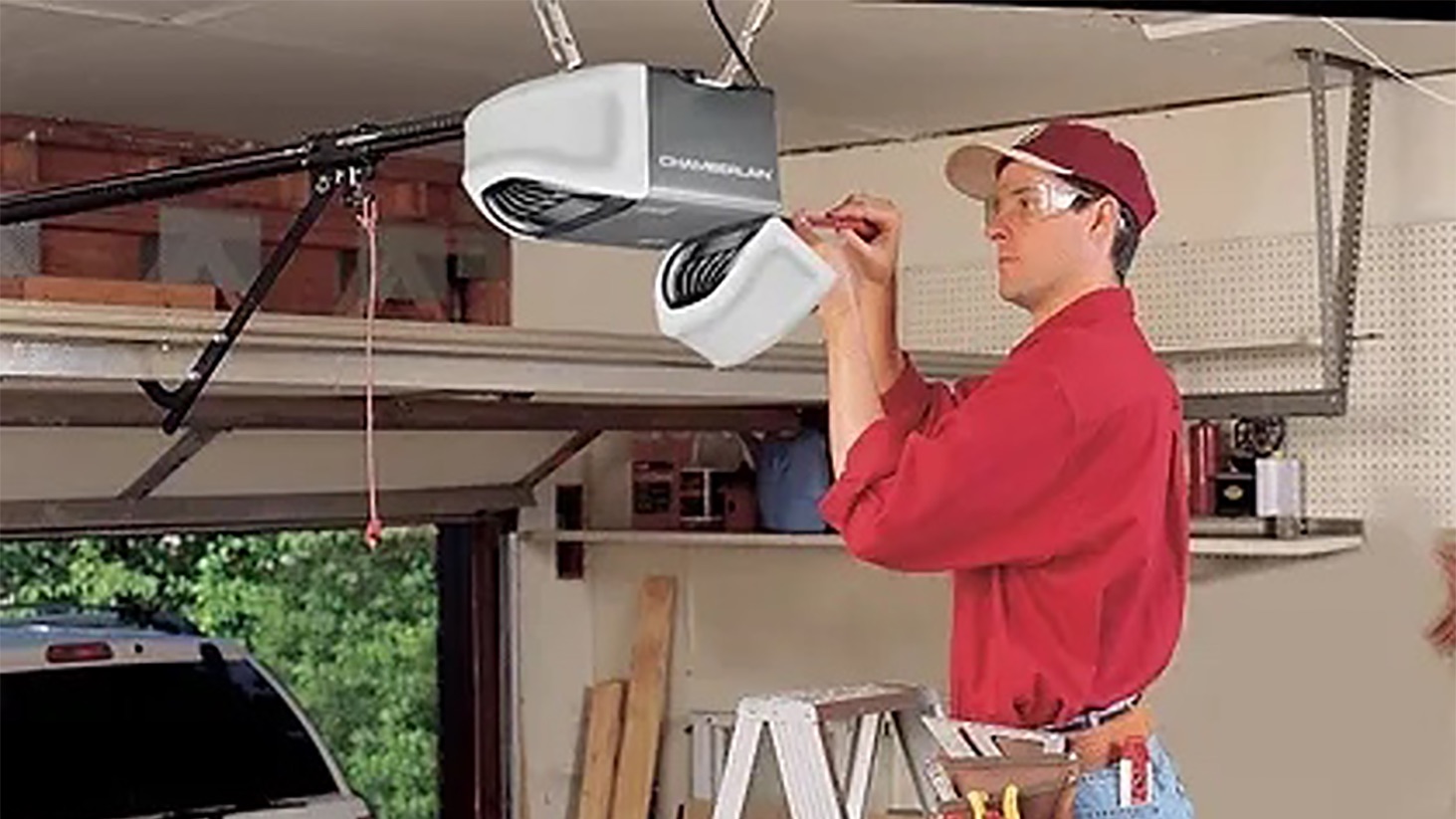 Technician installing a garage door opener